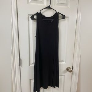 Sleeveless, small black dress.